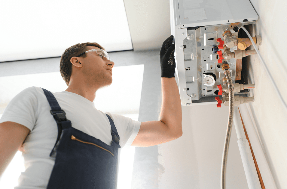 a plumber checking a boiler