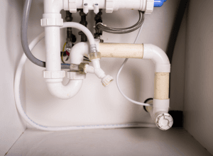 Plumbing pipes under the sink