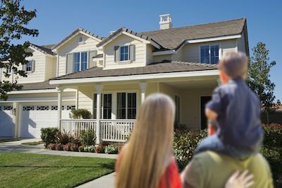 family looking at house