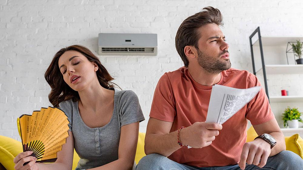 man and woman blowing their faces