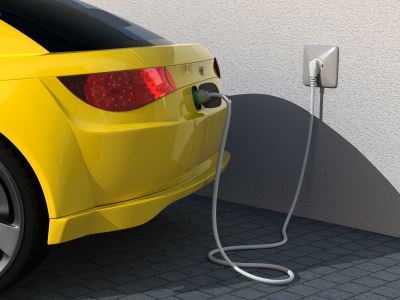 yellow car using ev charger